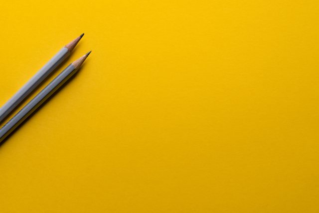 Pencil on yellow background for business 